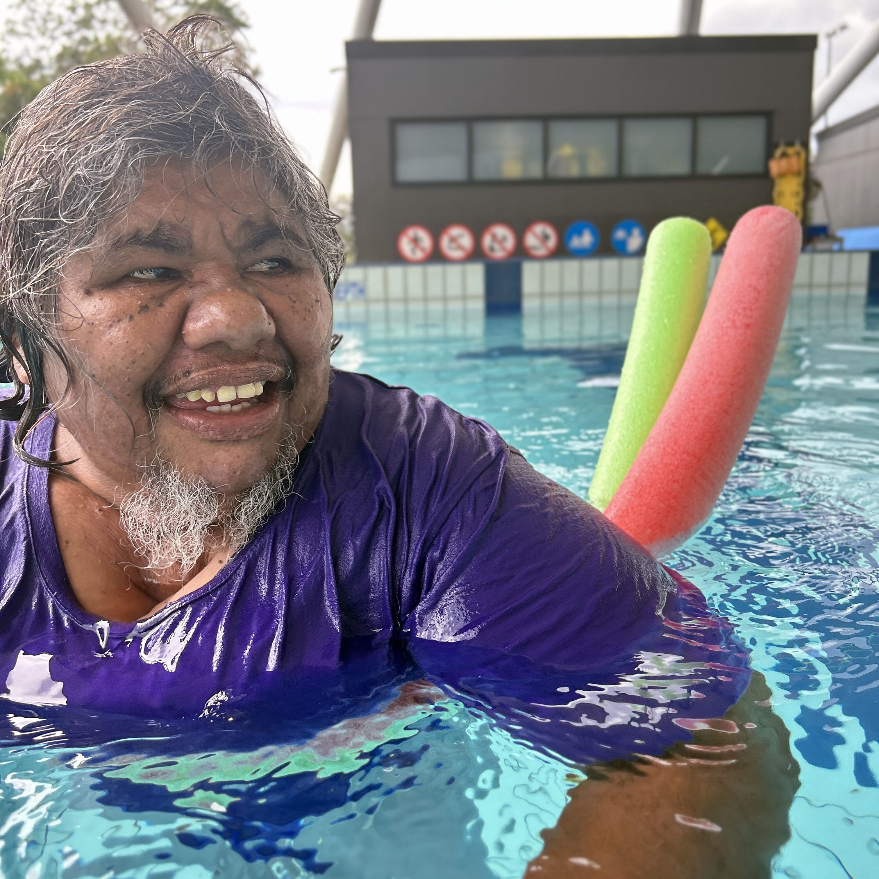 Joeanne swimming at Parap Pool in Darwin during a community outing.