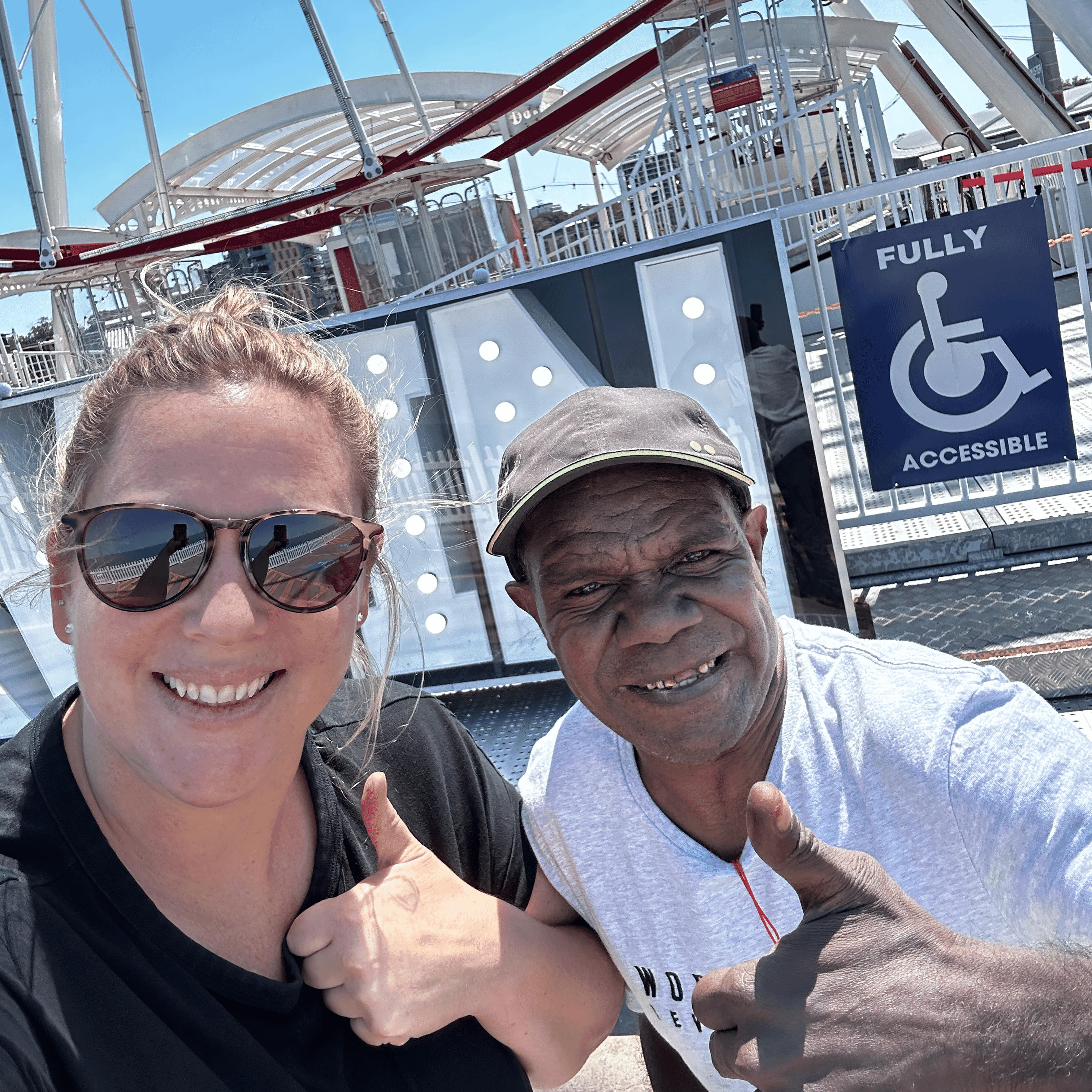 Nathaniel enjoying a ride on the Ferris wheel at Darwin Wharf with Bluegum community access.